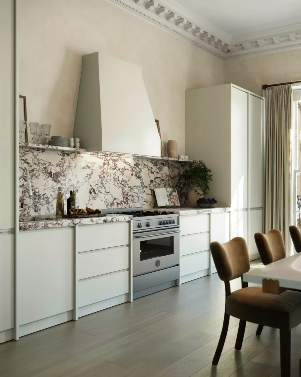 Section of modern kitchen with marble splashback.